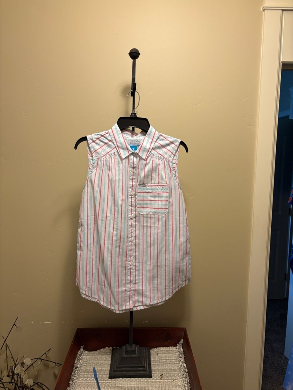 Columbia sleeveless button up blouse.